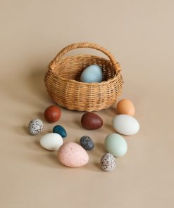 A Dozen Wooden Bird Eggs In A Basket
